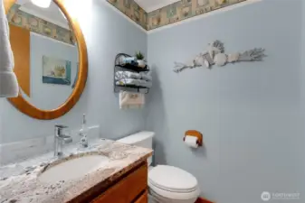 Conveniently located on the main floor, the half bath offers easy access for guests and everyday use.