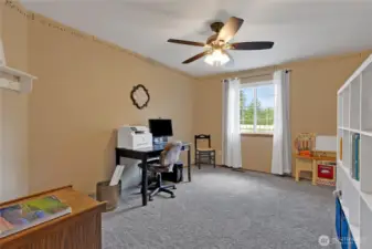Additional bedroom providing flexible space for guests, office, or personal use.