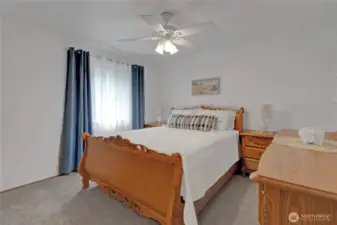 Comfortable bedroom offering ample space and natural light, adaptable to your personal needs.