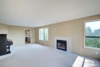 Living room with entrance to kitchen