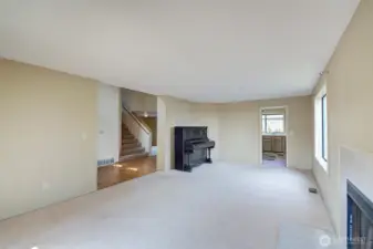 Living room with entrance to kitchen