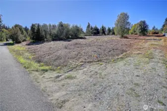 Access off NE Corner. Gravel access road.
