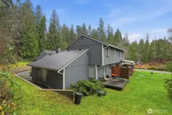 Backyard of 310 & 312, with 306 & 308 roof visible across the way.