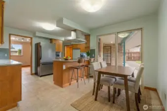 Virtually Staged. Breakfast area leading to covered patio for year round outdoor space.