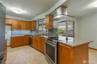 Kitchen cabinets complete with mixer lifting shelf and lined bread drawers.