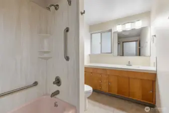 Hallway bathroom with full slab shower walls for easy cleaning and a great look!