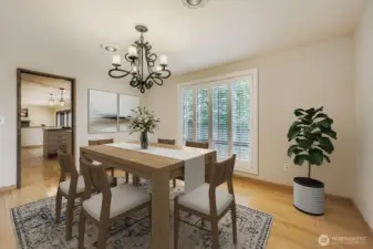The spacious dining room also features floor-to-ceiling windows with plantation shutters that overlook the back yard and raised gardens.