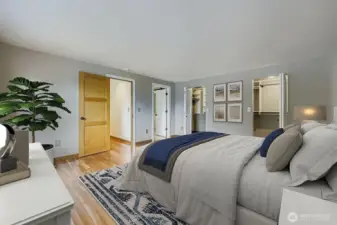 Hardwood flooring continues into the Primary Suite and the other 3 bedrooms. Two separate doors lead into the large custom closet with organizers.