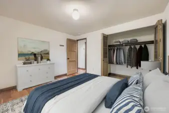 This third bedroom features ample closet space, gleaming hardwoods and a large window viewing the backyard. from this bedroom.
