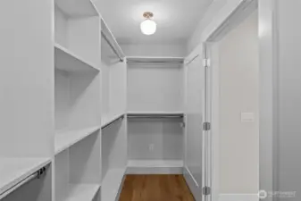 Walk in closet with tons of built ins! This is only half of this closet.