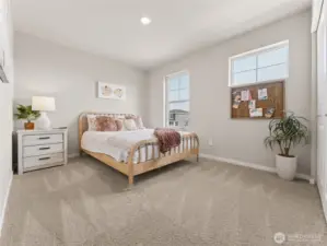 Bedroom, one of three secondary bedrooms.  Finishes and options may vary.