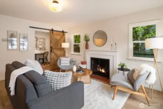Warm & cozy living room with original fireplace!