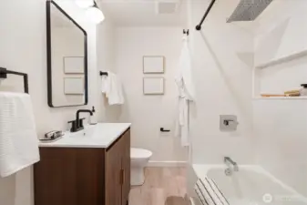 Full bathroom between second bedroom and living room.