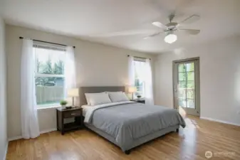 The master bedroom faces the back yard and has plenty of light.
