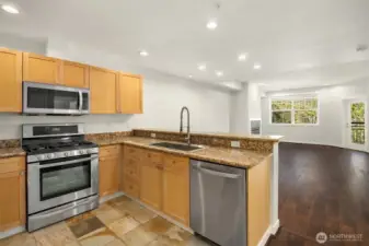 Open and inviting floorplan unfolds with newer flooring.