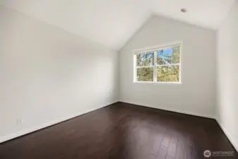 a generous walk-in closet, and a spa-like five-piece bath.