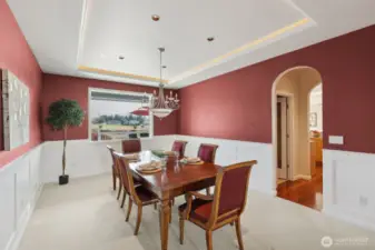 Welcome to your new dinner party haven! With stunning arched doorways and an LED-lit tray ceiling, this formal dining room is dripping with elegance. The classic white wainscoting adds a timeless touch, making every meal feel like a special occasion. Whether it’s a casual family dinner or an extravagant soirée, this space has you covered. Let the entertaining begin!