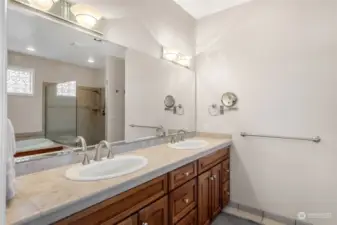 Mirror, mirror on the wall—who’s the most fabulous of them all? This primary suite vanity steals the spotlight with its extra-wide mirror and stunning brushed nickel fixtures. Dual vanities mean you can get ready side by side without a hitch. With sleek granite countertops providing a perfect blend of style and function, this space isn’t just for getting ready; it’s where you’ll start every day feeling like a star.