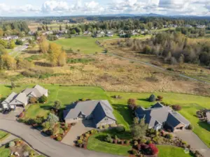 This aerial shot is giving major ‘wow’ vibes! The spacious lot, those stunning wetlands, and a coy Mt. Rainier hidden behind the clouds. Plus, with a hiking trail right at your doorstep, it’s like having a personal invitation to nature's best party. Get ready to explore!