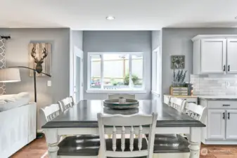 Dining area looking to nook with door to back entertaining and BBQ patio