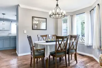 Formal dining room with bright bay window