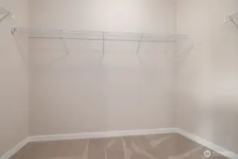Walk-in closet off of primary bedroom