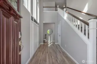 Grand entrance with vaulted ceilings and an open floorplan truly make this space inviting and a warm place to come home to.
