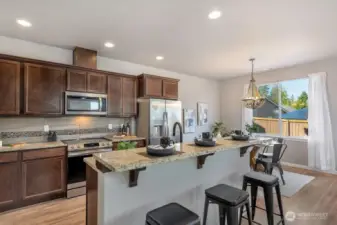 Modern Kitchen – Upgraded appliances, sleek glass touch controls, and a large prep island make cooking effortless.