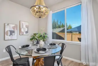 Bright dining space with smart lighting overlooking the backyard.