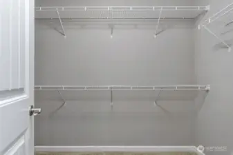 Primary Walk-In Closet – Generous storage with and hanging space.