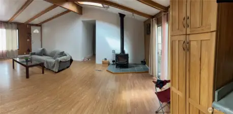 Spacious, Open Living Room With Vaulted Ceiling, Fireplace & Lots Of Natural Light Flowing In