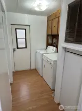 Laundry Room With Back door and door on left goes into main bath
