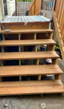 Brand new stairs leading to the front door.