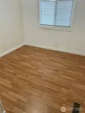2nd bedroom with new flooring and moulding