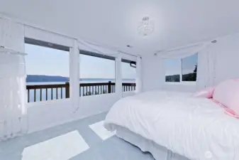 This primary bedroom is so sunny and light!