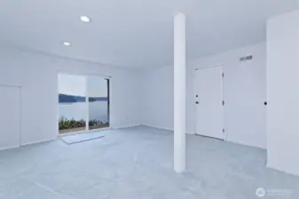 This is the downstairs rec room with a slider to the patio.
