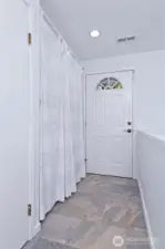 The upstairs entry.