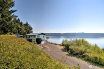 Taken from the main road (North Hill Road). The driveway is shared with the house behind, and loops around to be a circular driveway.