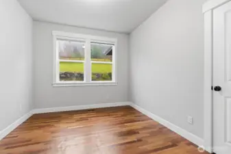 Main floor bedroom #1. Brazilian Cherry hard wood floor.