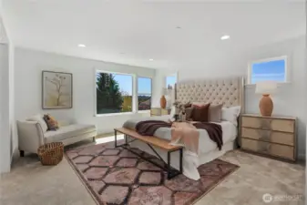 Primary Bedroom: The spacious primary retreat offers an airy layout with large windows that frame natural light throughout the day. Plush carpeting and a versatile sitting area make this room both functional and luxurious, perfect for unwinding in comfort.  Staged photos are of the model home of the same floorplan within the Foxmoore community and are for visualization purposes only. Colors, finishes, and layout can and will vary.