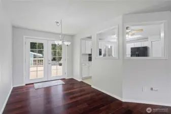 This dining room with french doors leads to the oversized deck...perfect for outdoor entertaining