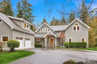 The home is located in a quiet cul-de-sac connected to trails. The home has a circular drive and beautiful, mature landscaping.