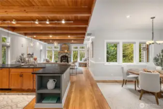 Looking from the front door to the south facing living room and dining space.
