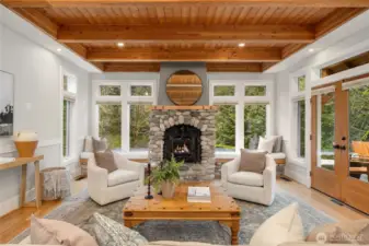 The living room has a river rock propane fireplace.