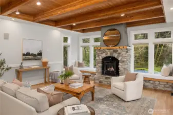 The oversized windows let in plenty of light and gorgeous greenery surrounding the home.