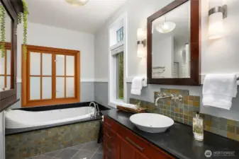 The primary bath has a walk-in shower, jetted tub and tons of natural light.