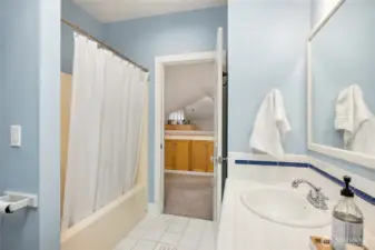 The upper bathroom has a tub and shower.