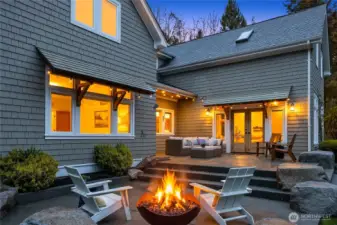 The two tiered patio has a propane line for a grill, two seating areas and a cozy propane fire pit. Perfect summer nights are almost here!