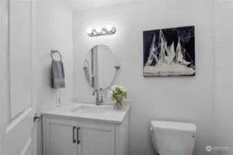 Updated primary bathroom with quartz vanity and undermount sink.