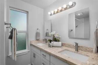 Hall bathroom has quartz counter top and 2 undermounted sinks.